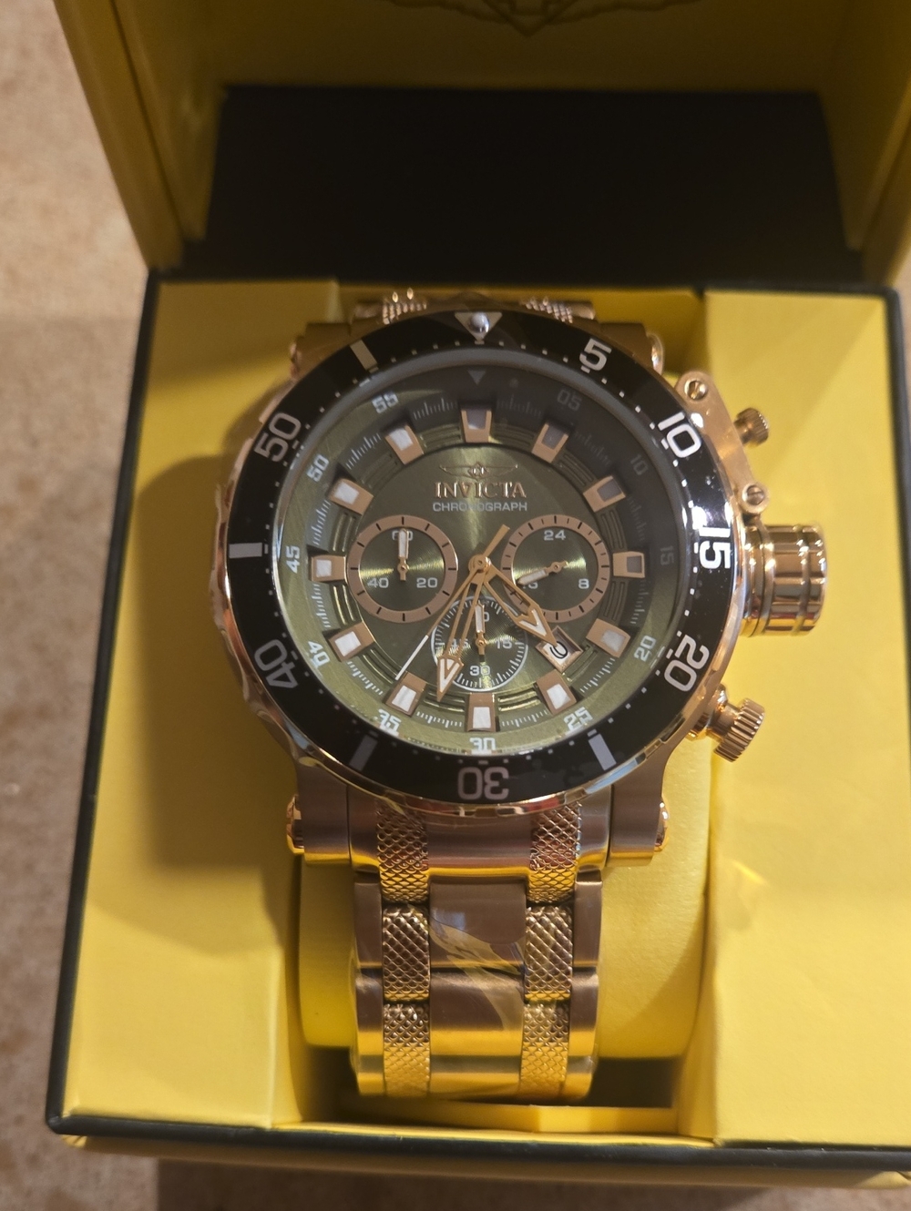 Invicta Gold and Black Chronograph Watch with Green Dial